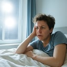 human with disrupted sleep due to excessive bright artificial lights outside