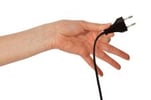 HAND HOLDING POWER CORD AND PLUG