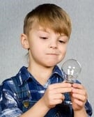 child looking at bulb