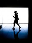 woman walking through office building