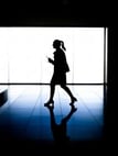 woman walking through office building